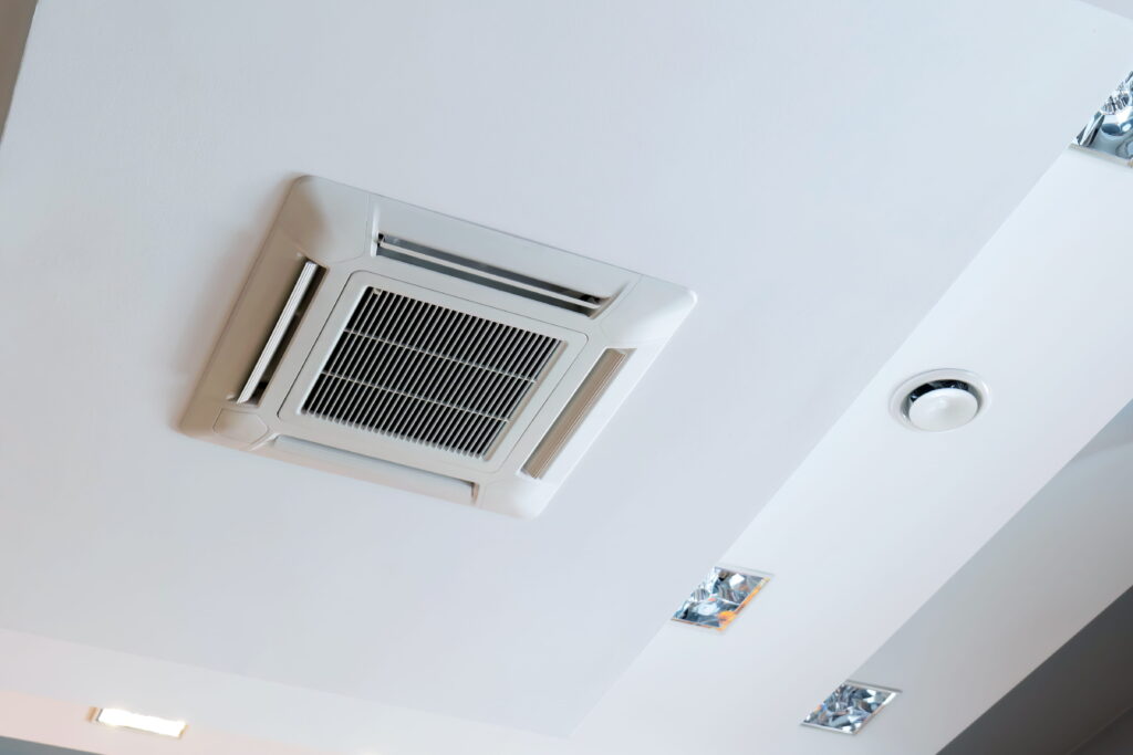 Ceiling-mounted cassette air conditioning unit in a commercial office building