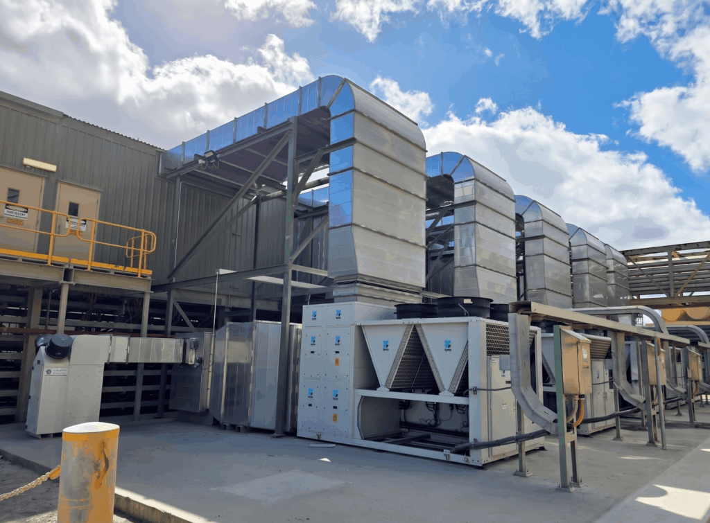 Newly installed package AC units and insulated stainless steel ductwork at a WA mining site